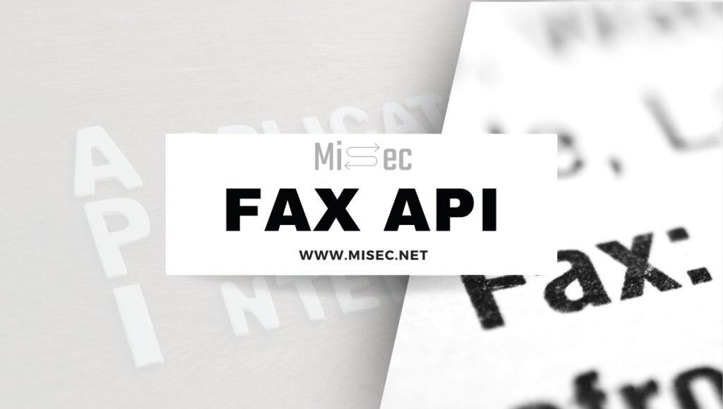 A fax machine and computer on a desk that utilizes fax API.